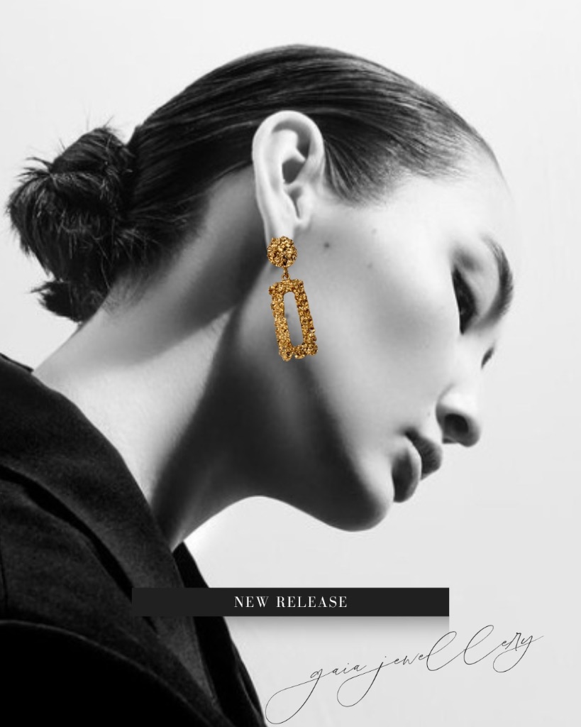 Model wearing GAIA molten gold earrings